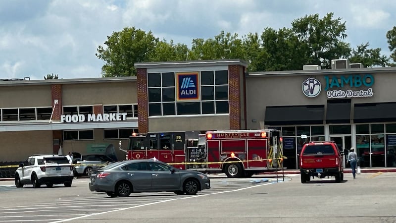 At least one person was loaded into an ambulance following the crash