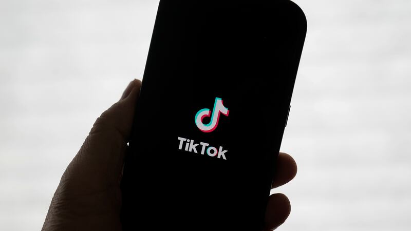 A TikTok logo is shown on a phone in San Francisco, Friday, Jan. 17, 2025. (AP Photo/Jeff Chiu)